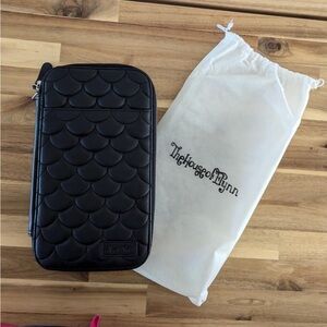 The House of Flynn traveler’s wallet.